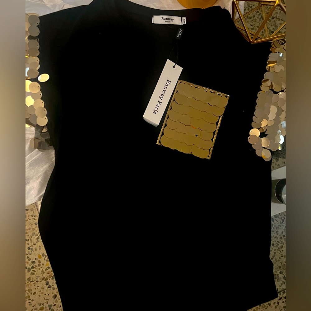 Shirt was never used. Includes labels. Size: Medium/Large